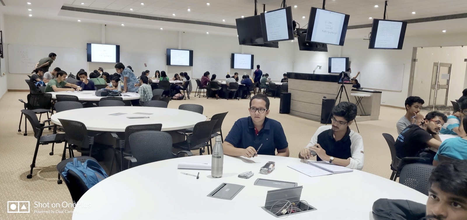Students collaborating at Studio AIR's round tables during a live active-learning session.